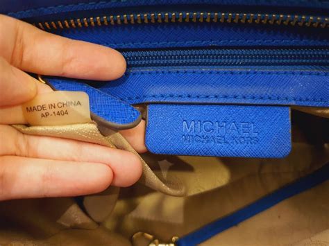 how to tell if a mk purse is real|michael kors purses serial number.